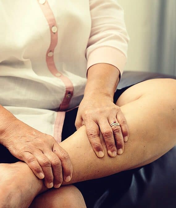 woman rubbing sore leg soothe with cbd